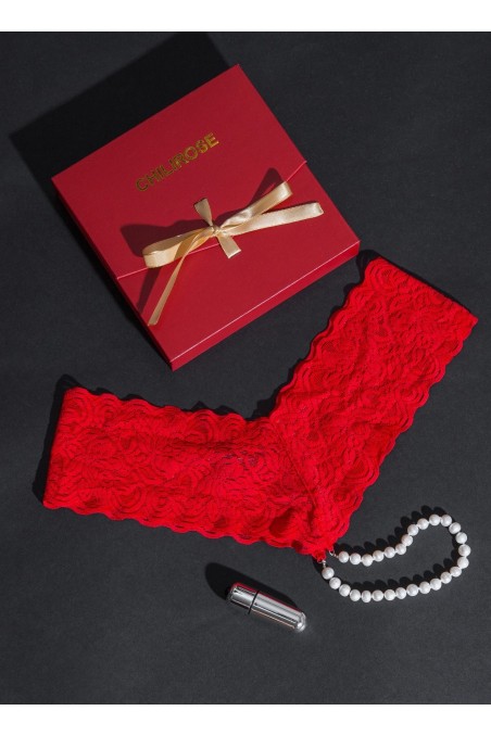 Perizoma rosso con perle naturali e gadget erotico